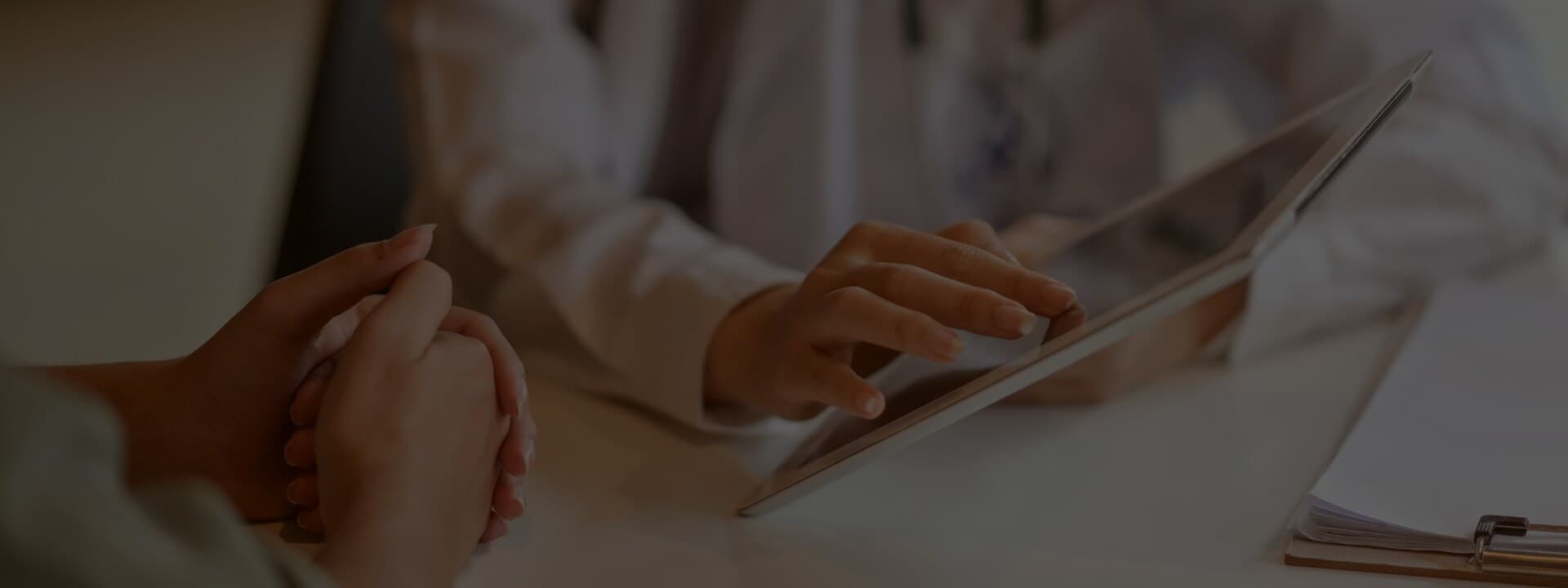 Person's hand using a tablet.