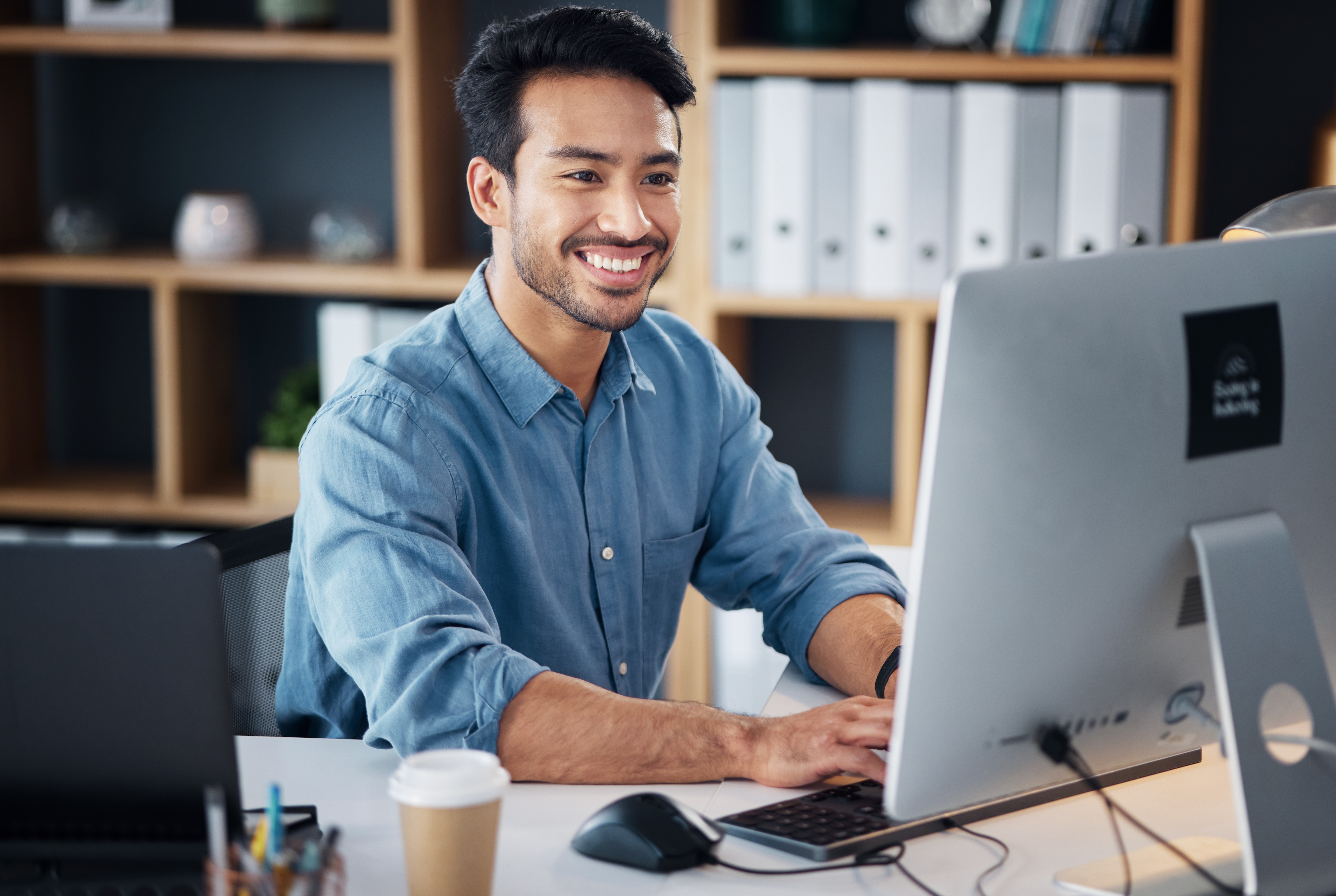 Happy person working on a desktop
